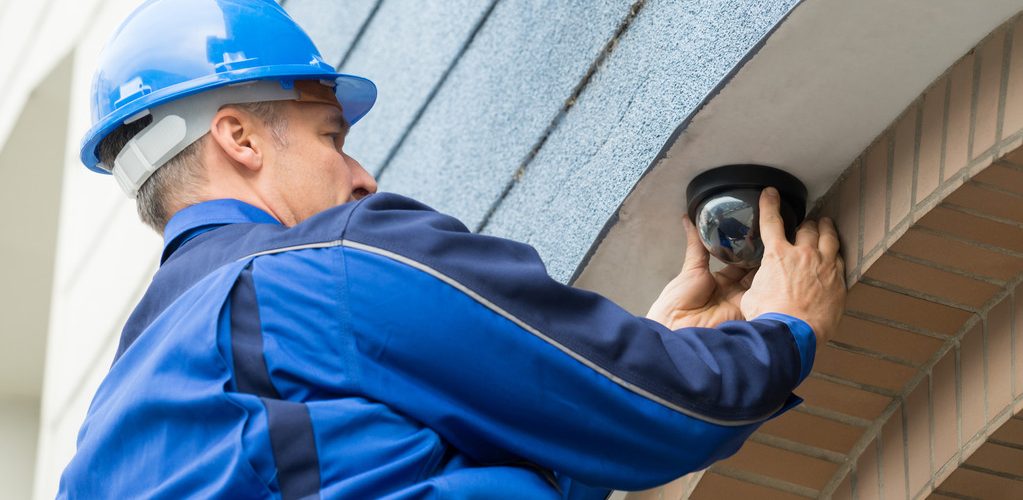Male Technician Installing Camera