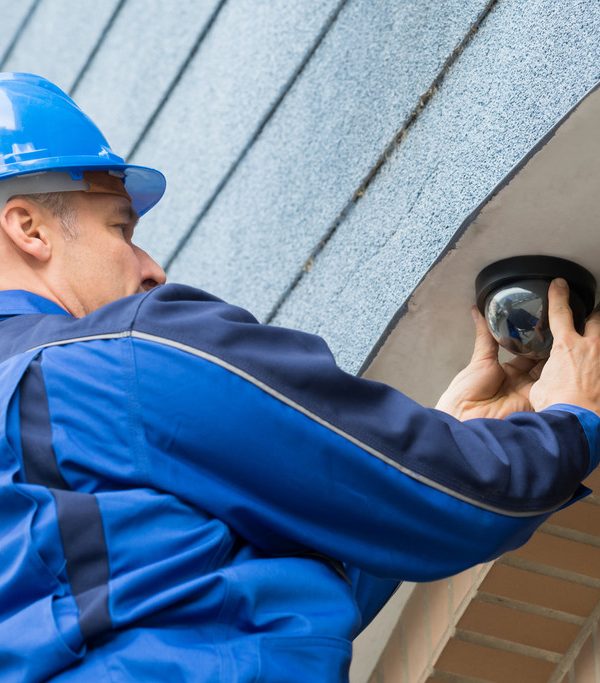 Male Technician Installing Camera